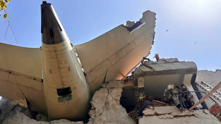 The jet's tail wedged into a building in Ahmedabad on Thursday in an image released by Indian government officials.