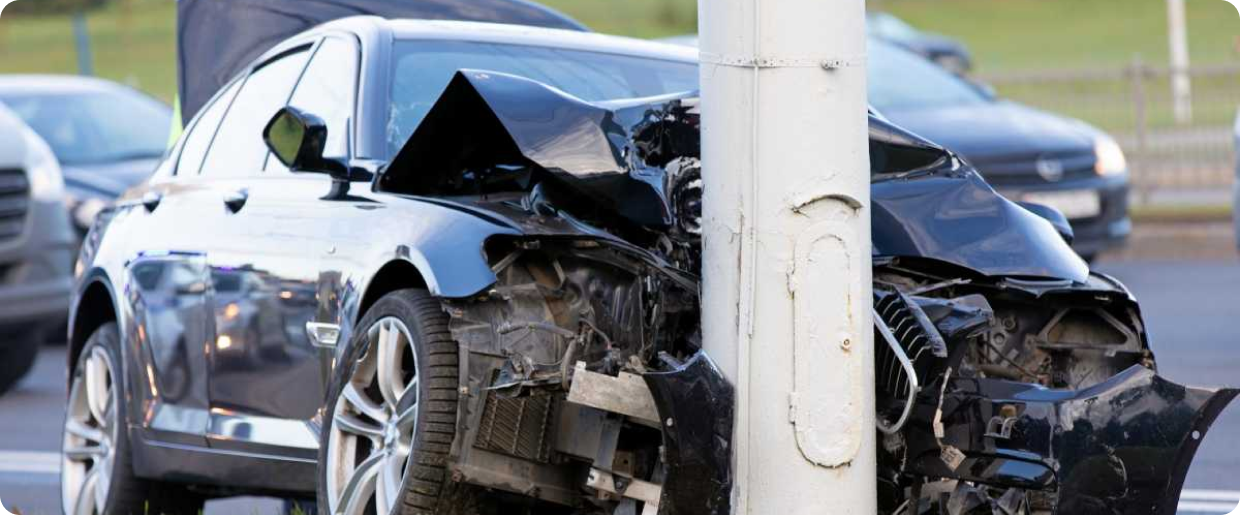 a car crashed to the pole on the road