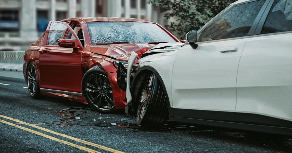 A red car and a white car collide head-on, illustrating a traffic accident scenario.