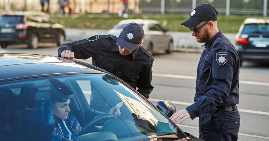Accident report form with car keys and pen