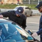 Accident report form with car keys and pen