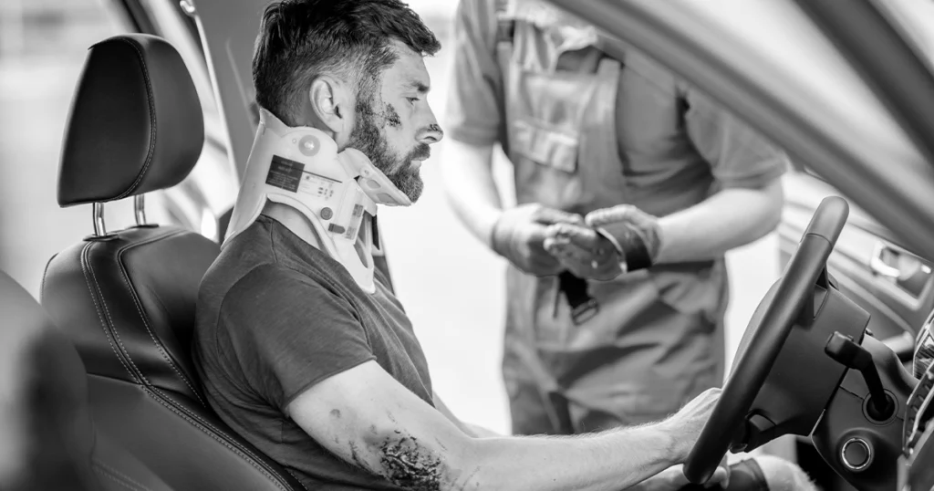 Injured driver with neck brace after serious car accident