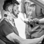 Injured driver with neck brace after serious car accident
